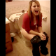 A short but sweet video clip of a girl peeing while sitting on a toilet with her mouth gaping open.